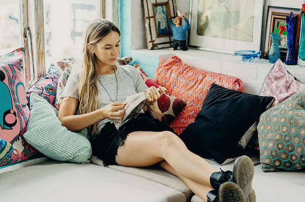 lady reading on a couch