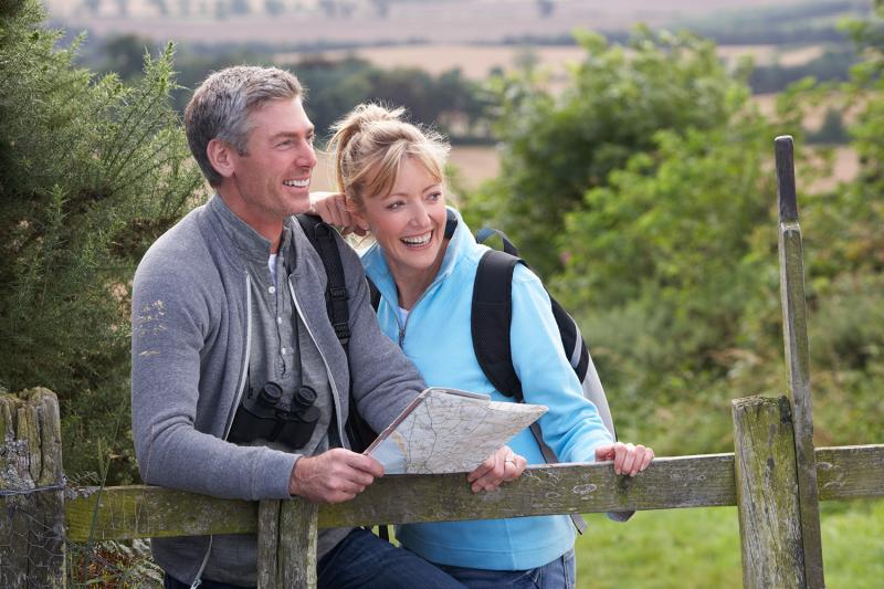 Man and Woman holding a map in nature